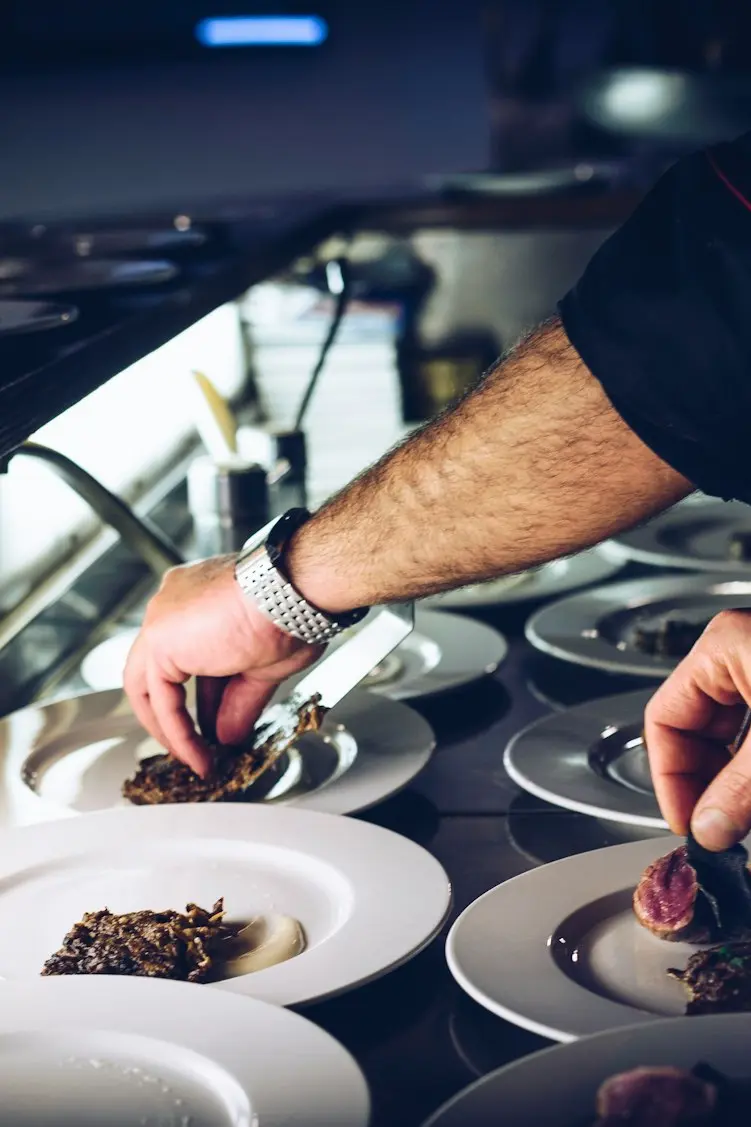 person preparing cooked dish